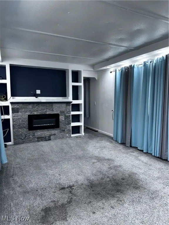 Unfurnished living room with carpet
