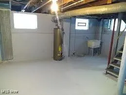 Basement featuring water heater