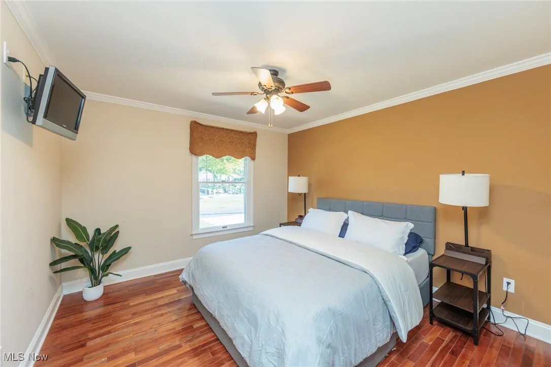 Bedroom on main floor with adjoining door way to guest bathroom