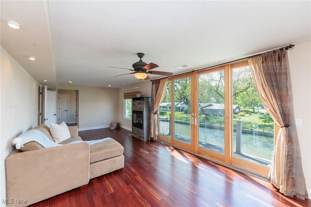 Massive primary bedroom suite with private upper balcony overlooking the channel with beautiful water views out to the lake