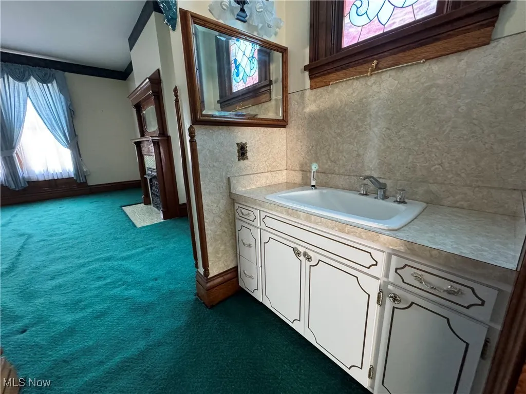 Bathroom with plenty of natural light and vanity