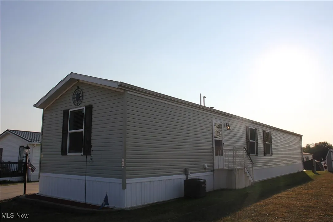 Property exterior at dusk with central AC