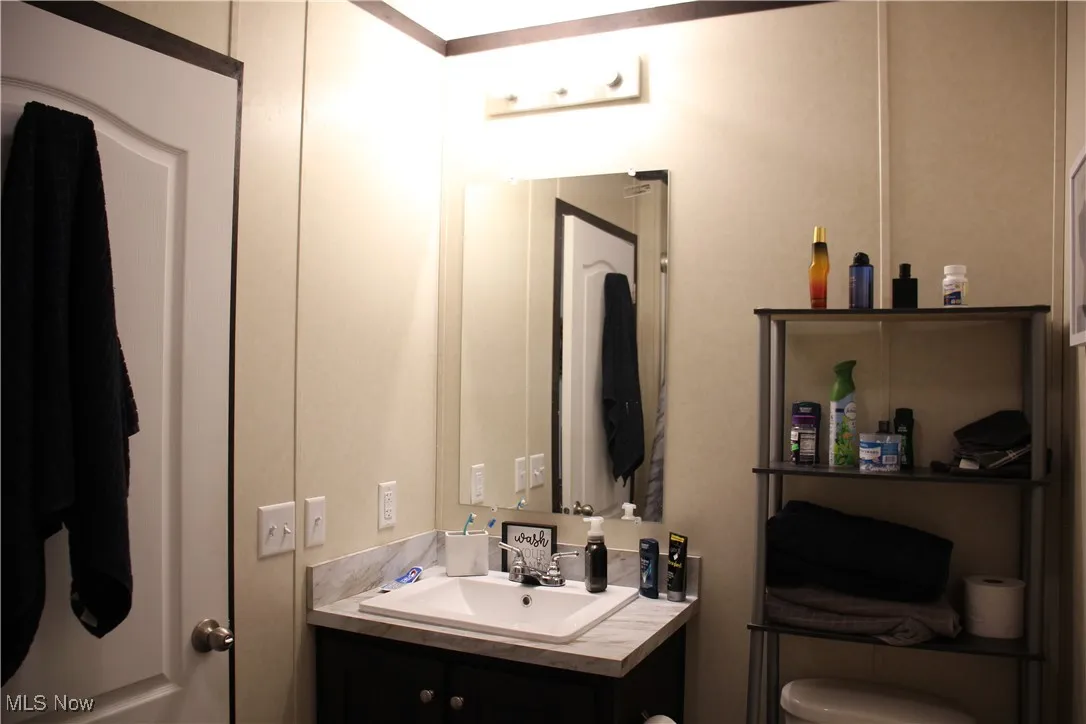 Bathroom with vanity and toilet