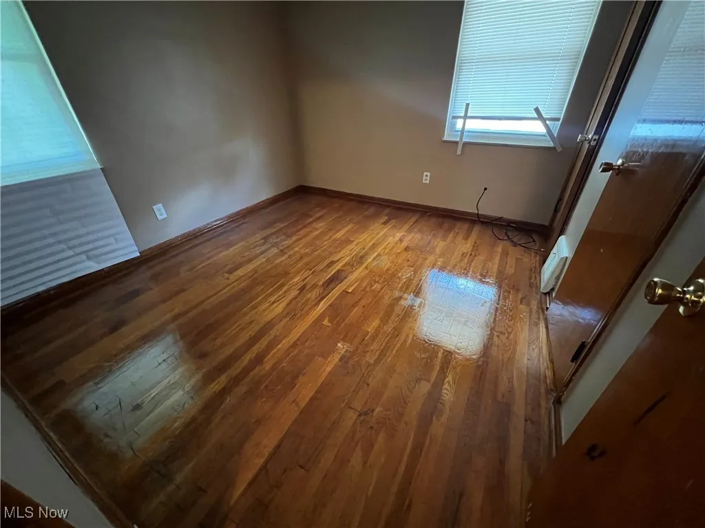 Spare room featuring hardwood / wood-style floors