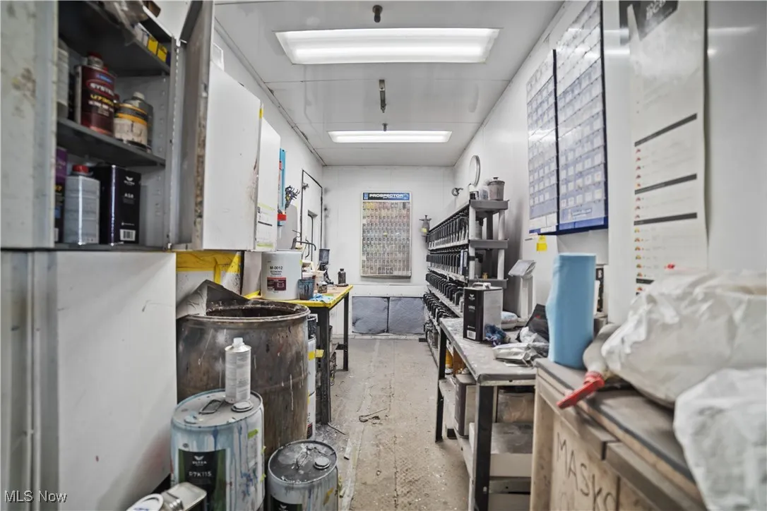 Miscellaneous room with a workshop area and concrete floors