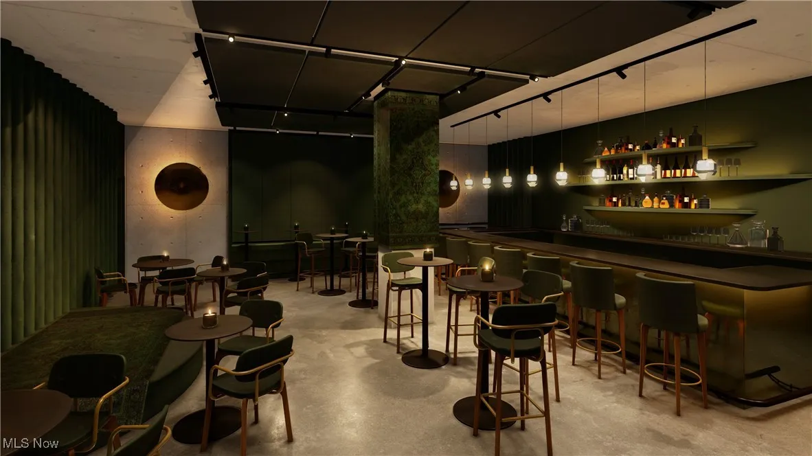 Bar featuring decorative light fixtures