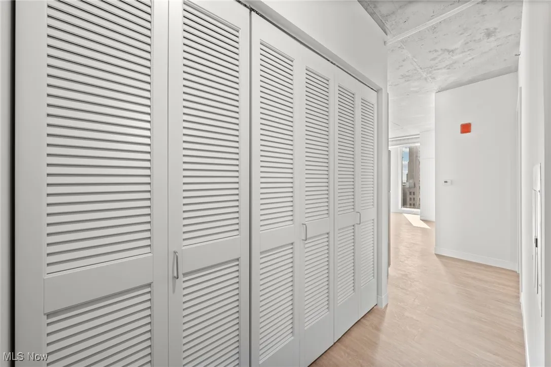 Corridor with light wood-type flooring