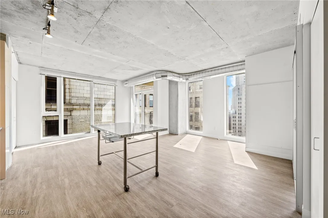 Playroom with light hardwood / wood-style floors and plenty of natural light