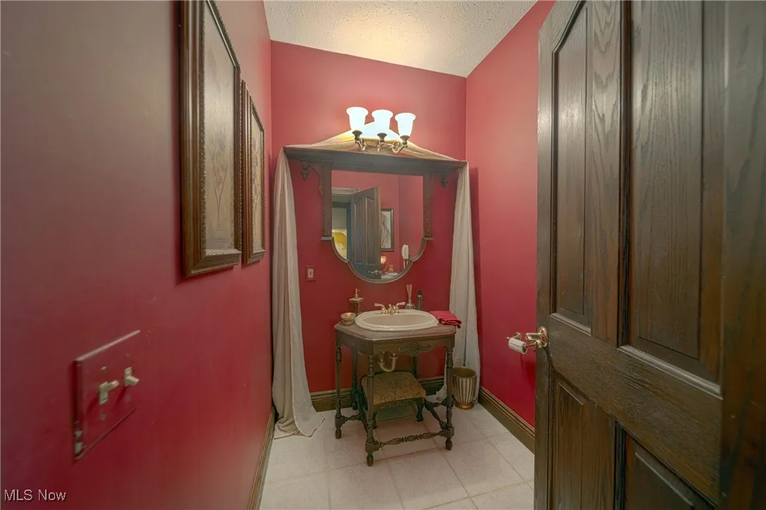 Bathroom with sink and tile flooring