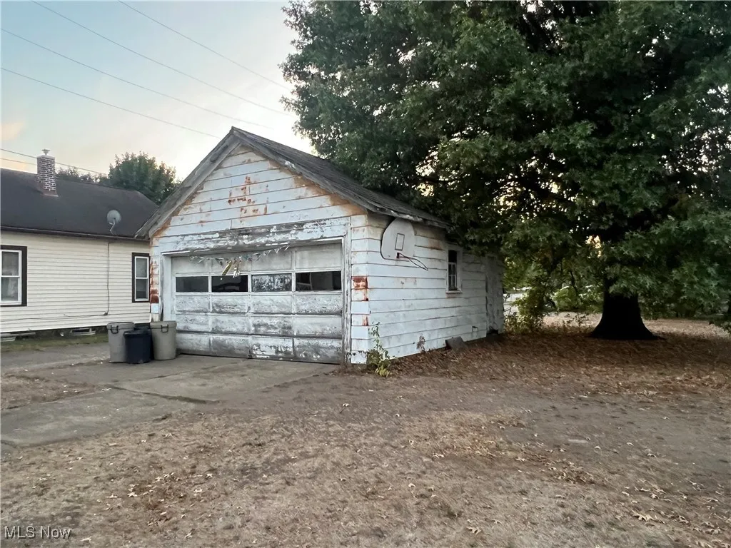 View of garage at dusk