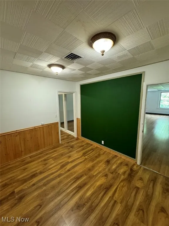 Spare room with wood-type flooring