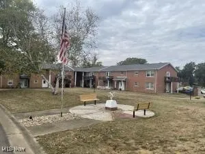View of community featuring a yard