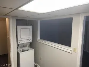 Laundry area featuring stacked washer / dryer