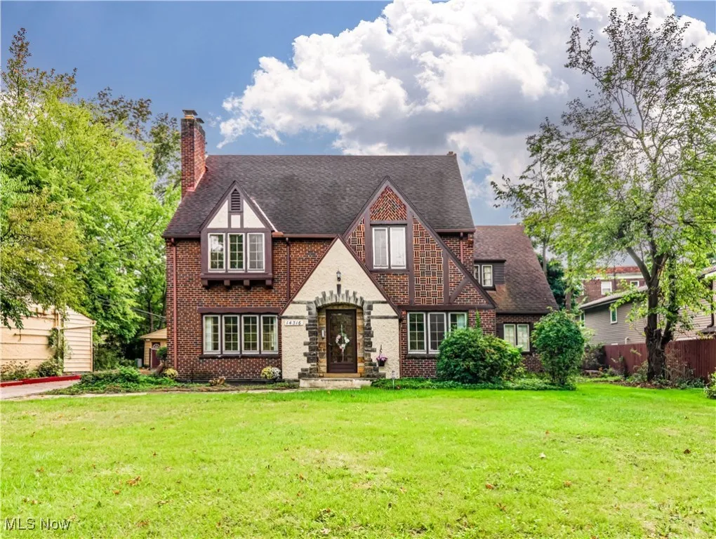 Tudor home with well manicured front yard