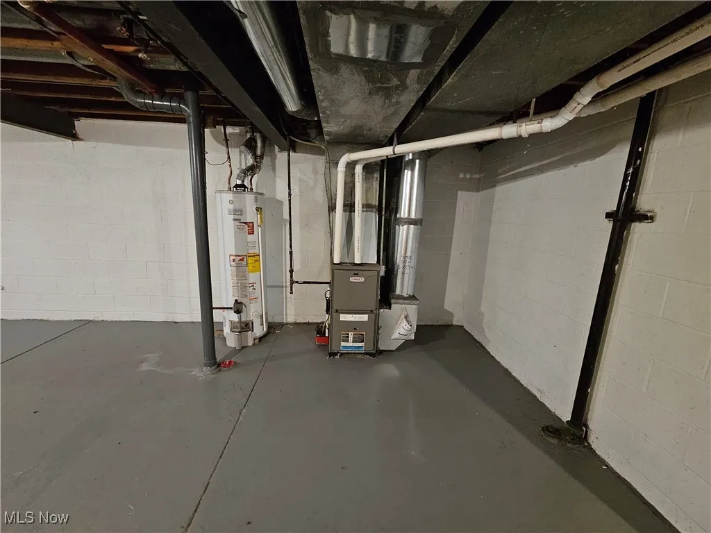 Basement with water heater and heating unit