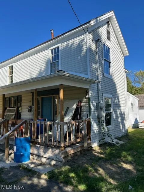 Front of property with covered porch