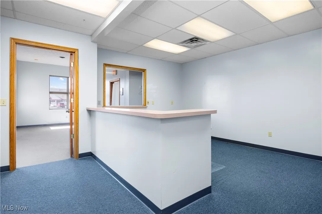 Spare room featuring a drop ceiling