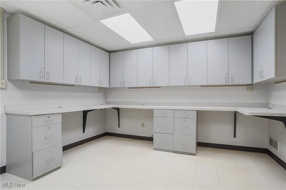 Unfurnished office with a paneled ceiling