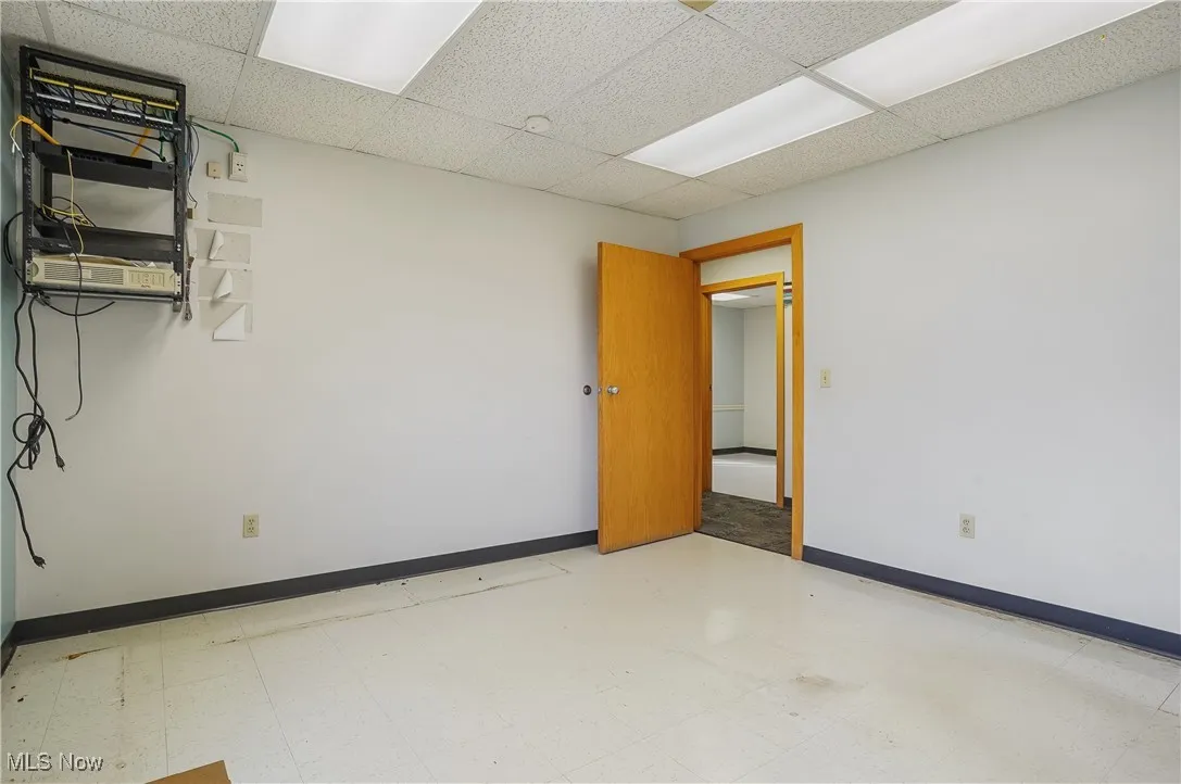 Empty room featuring a paneled ceiling