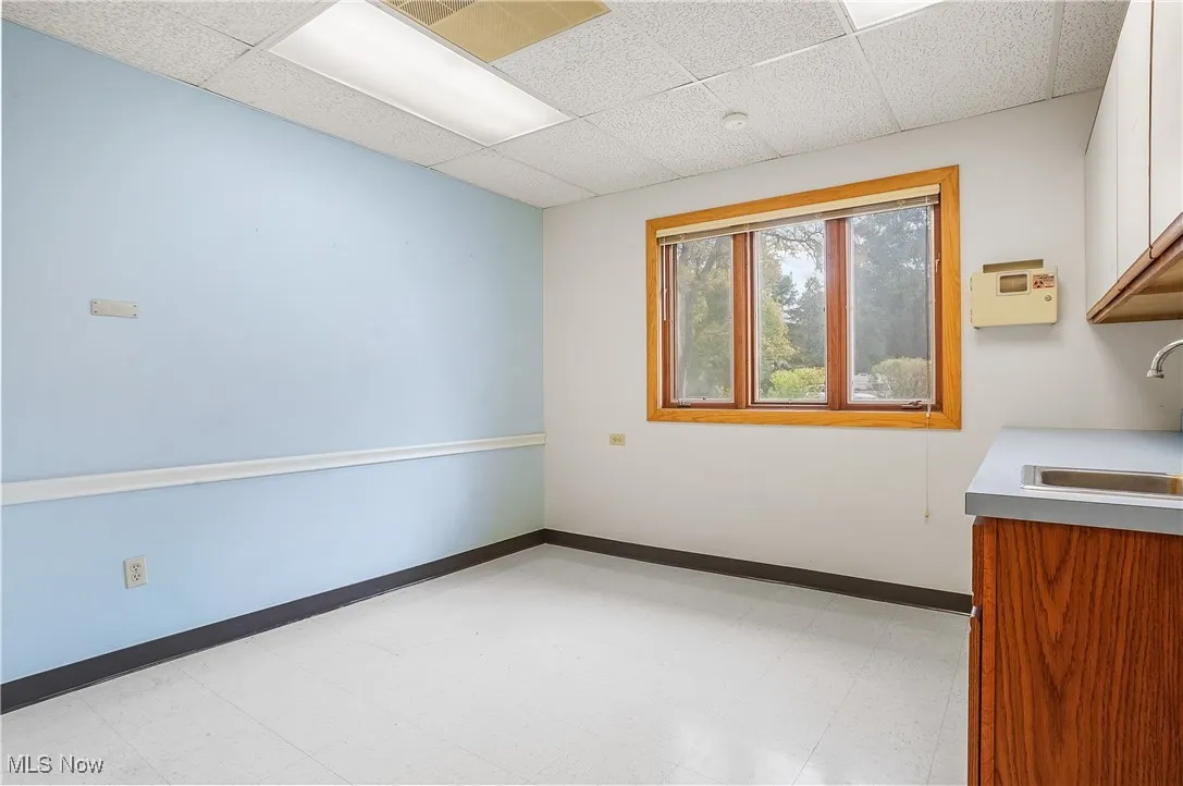 Spare room with sink and a paneled ceiling