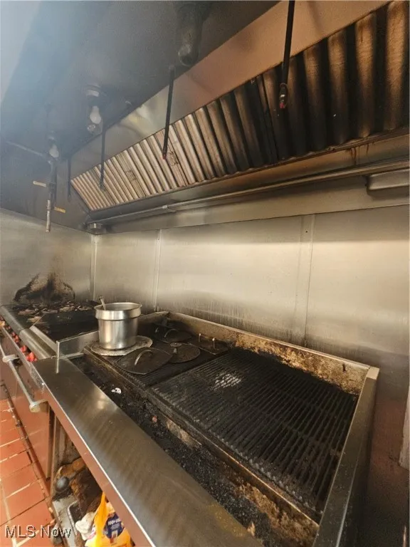 Kitchen featuring stainless steel cooktop