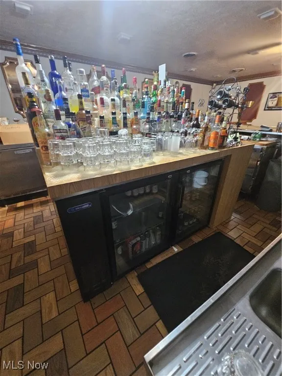 Bar featuring crown molding