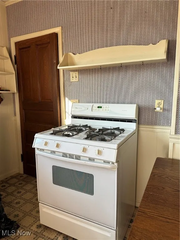 Kitchen with white gas range