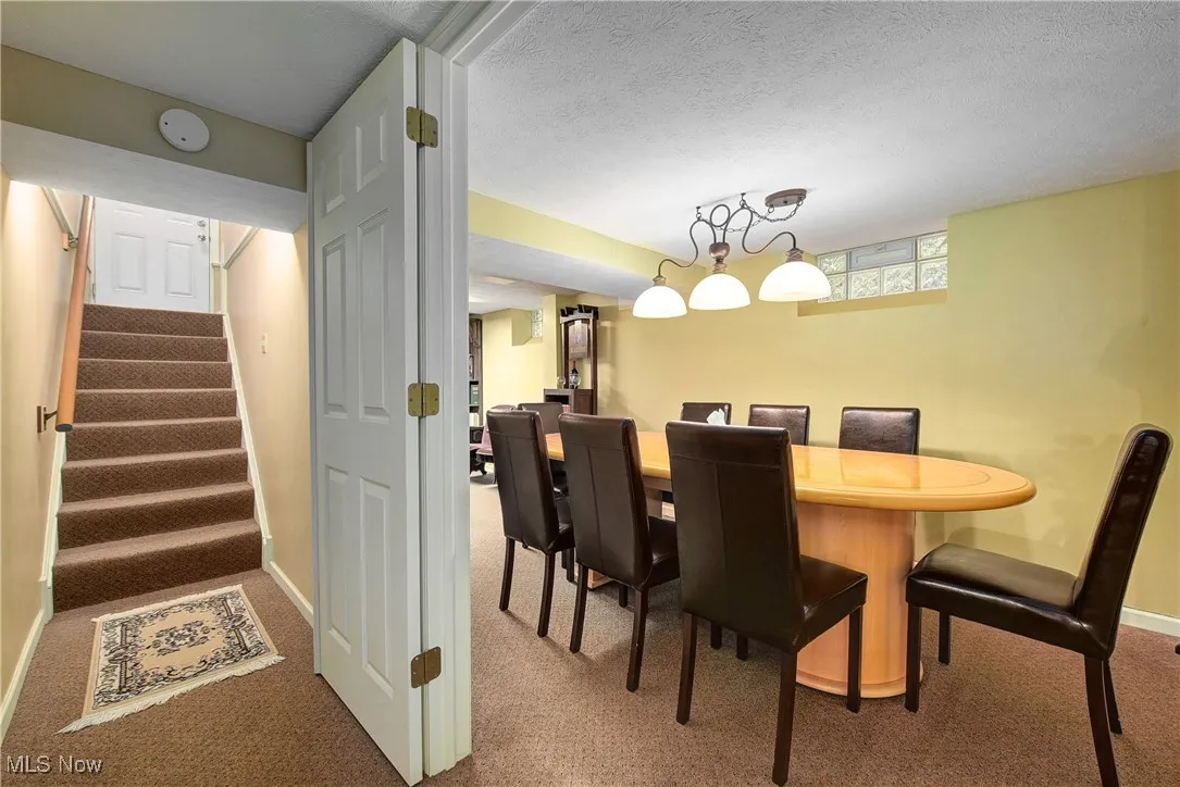 Conference Room with a textured ceiling and carpet