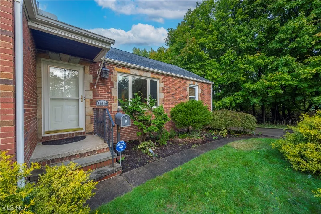Entrance to property featuring a lawn