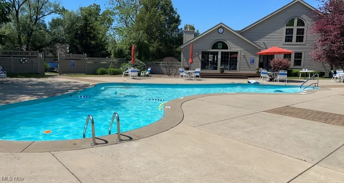 View of swimming pool with a patio