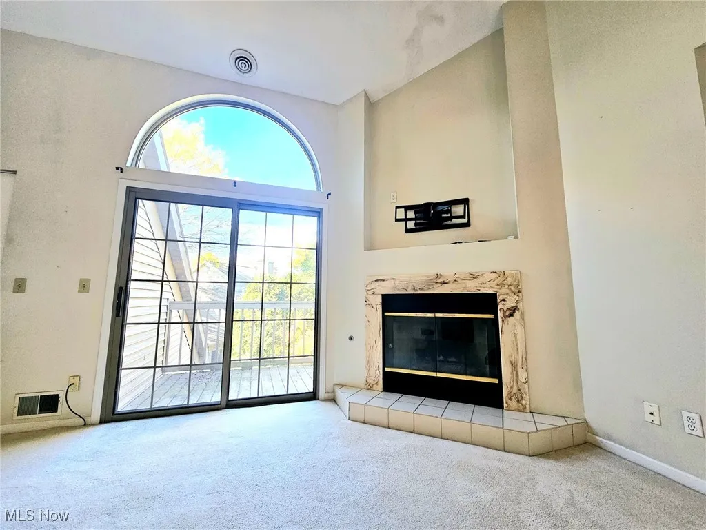 Gas fireplace And Large Slider to balcony