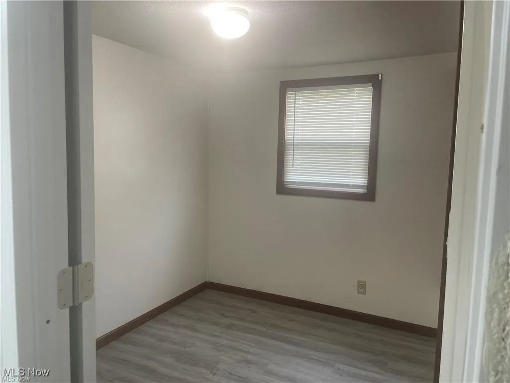 Spare room featuring light hardwood / wood-style floors