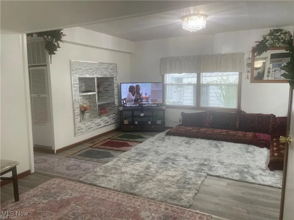Living room with dark hardwood / wood-style floors