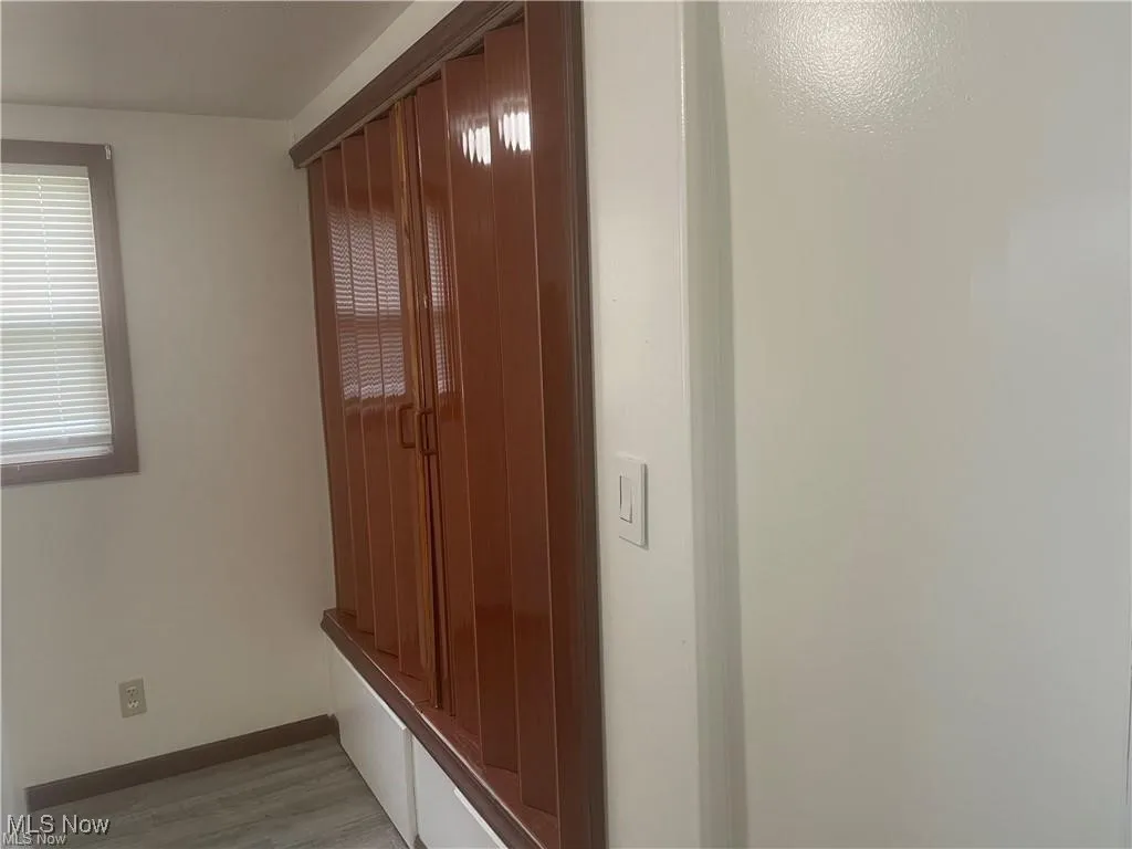 Mudroom with light hardwood / wood-style floors