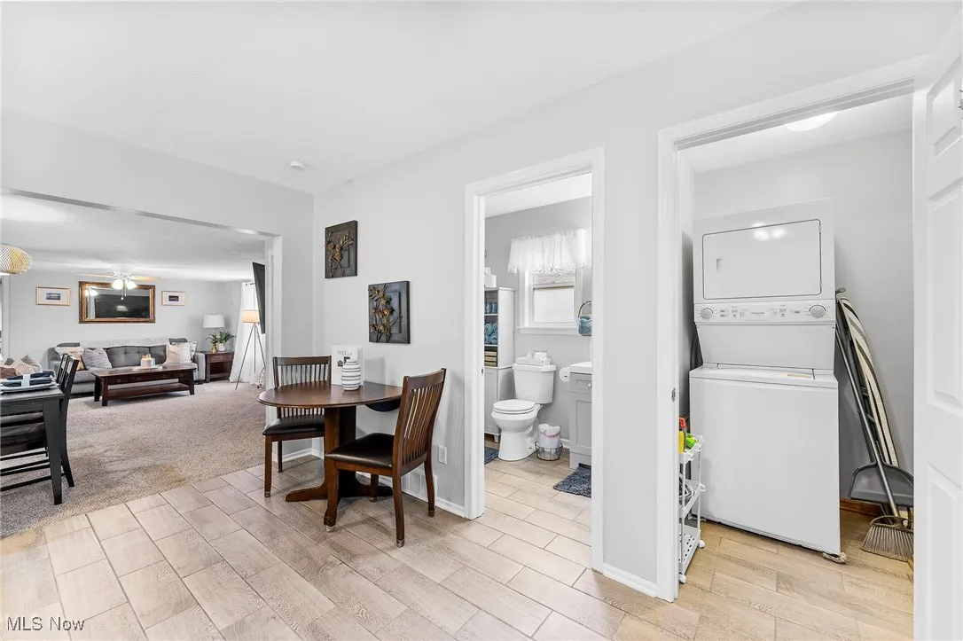 View of eat-in kitchen, laundry room and bathroom