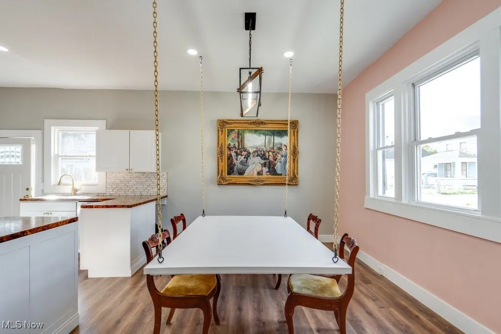 Dining space featuring hardwood / wood-style flooring and a wealth of natural light