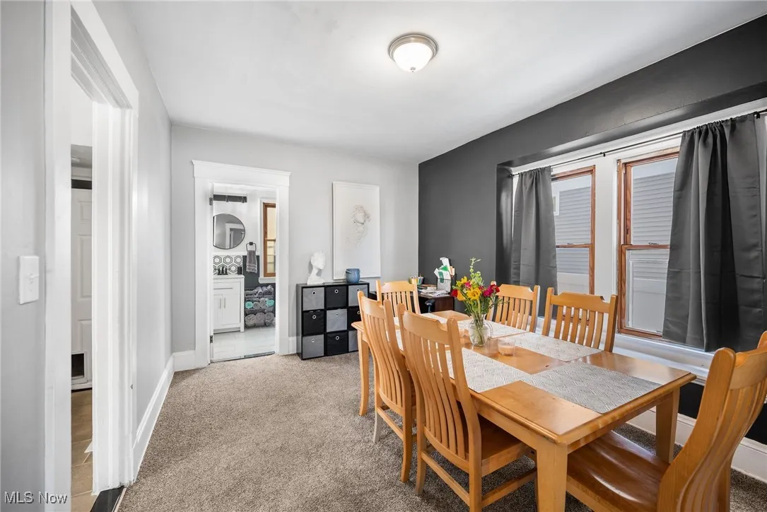 Dining area featuring light colored carpet