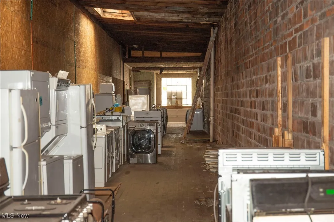 Misc room with separate washer and dryer and vaulted ceiling