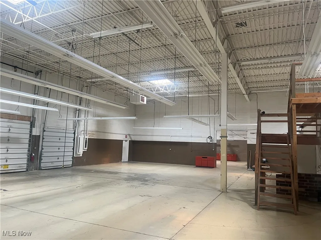 5000 sq ft. Large warehouse with 2 loading docks and 2 large overhead doors.