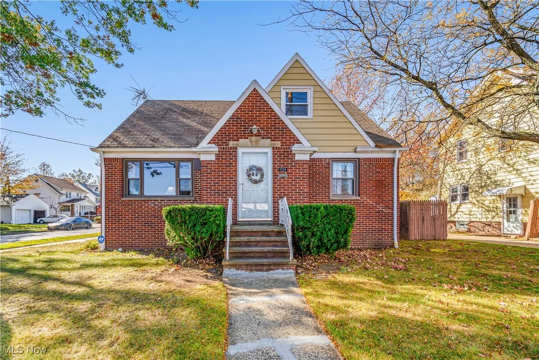Front view of beautiful brick cape cod