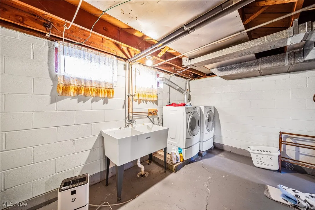 Laundry area with large wash sink.