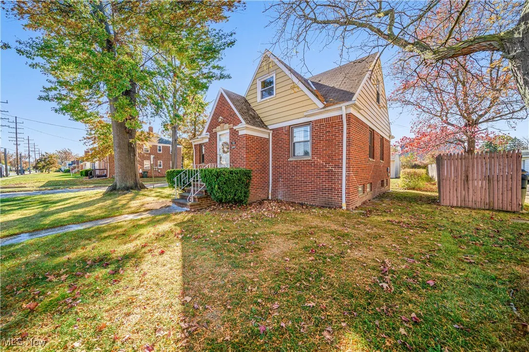 Right side view of brick cape cod