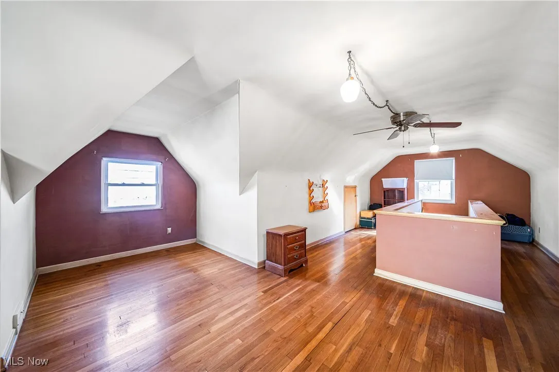 Large upstairs bedroom space with beautiful hardwood floors and built ins.