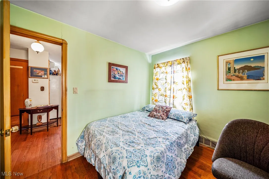 Main floor bedroom #2 with hardwood floors