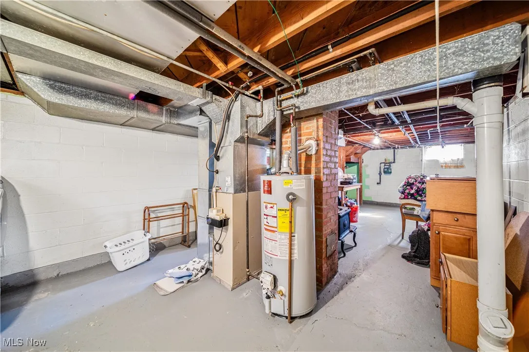 Furnace and Hot Water Tank in unfinished section of basement