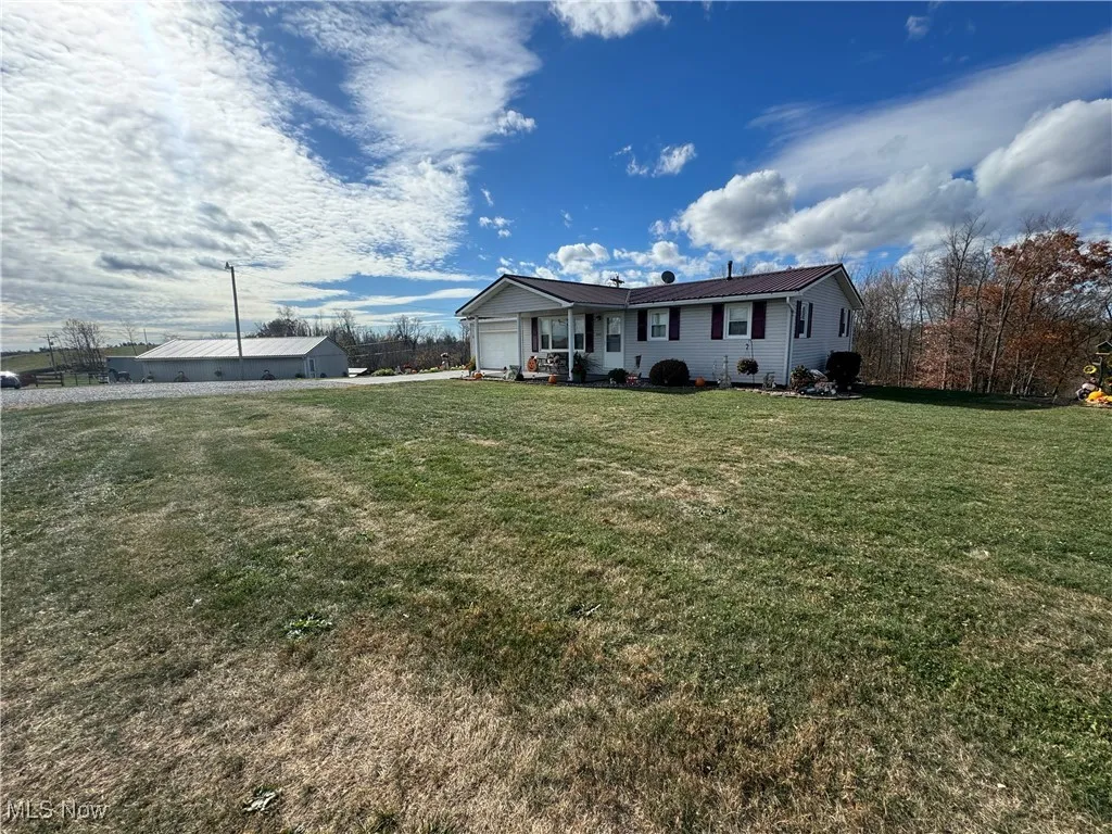 View of front of house with a front yard