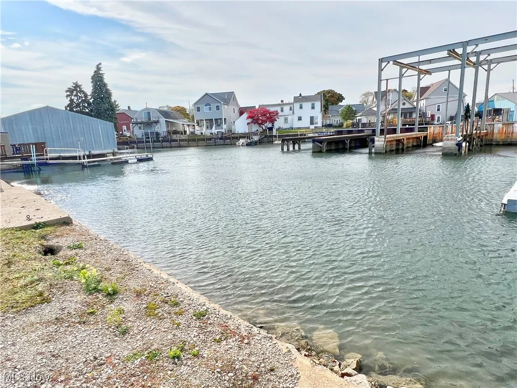 Water view featuring a dock