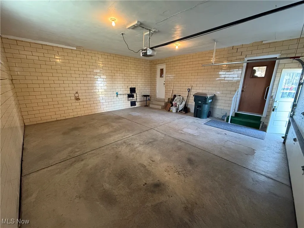 Garage featuring a garage door opener
