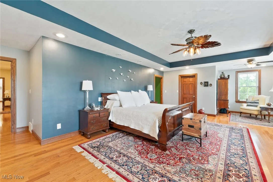 Bedroom featuring light hardwood / wood-style flooring and ceiling fan
