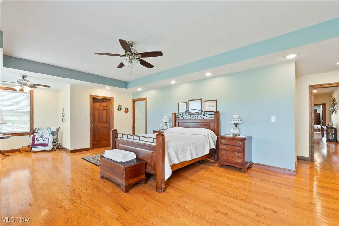 Bedroom featuring ceiling fan and light hardwood / wood-style floors